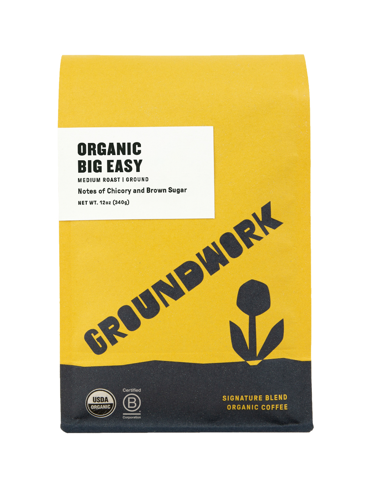 A yellow and white Groundwork Coffee Store Big Easy medium roast bag features black text, a flower graphic, and chicory notes.
