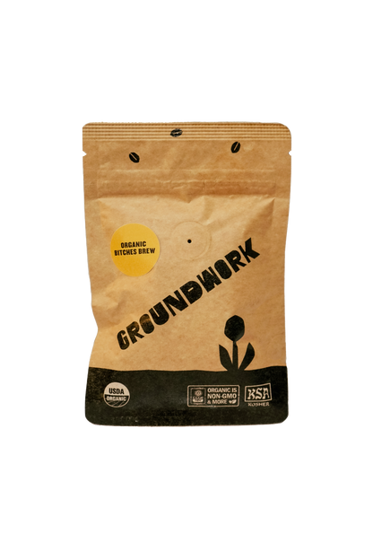 A brown bag of Groundwork Coffee labeled Coffee Sample, part of their Signature Blends, with USDA Organic and non-GMO certifications on the front.