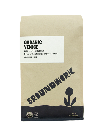 A brown paper bag of Groundwork Coffee Venice whole bean, a dark roast with marshmallow and stone fruit notes.